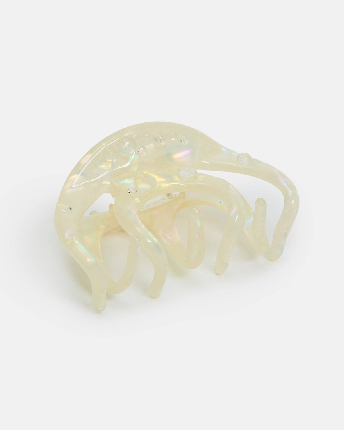 Clear plastic hair clip on a gradient background