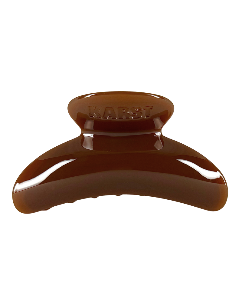 Brown hair clip on a white background