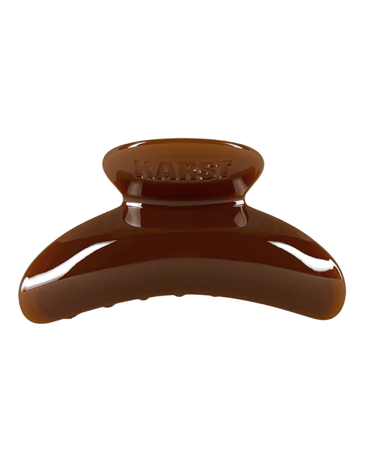 Brown hair clip on a white background
