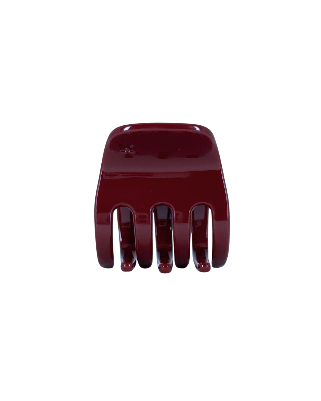 Red hair comb on a white background