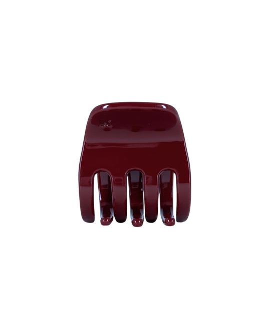 Red hair comb on a white background