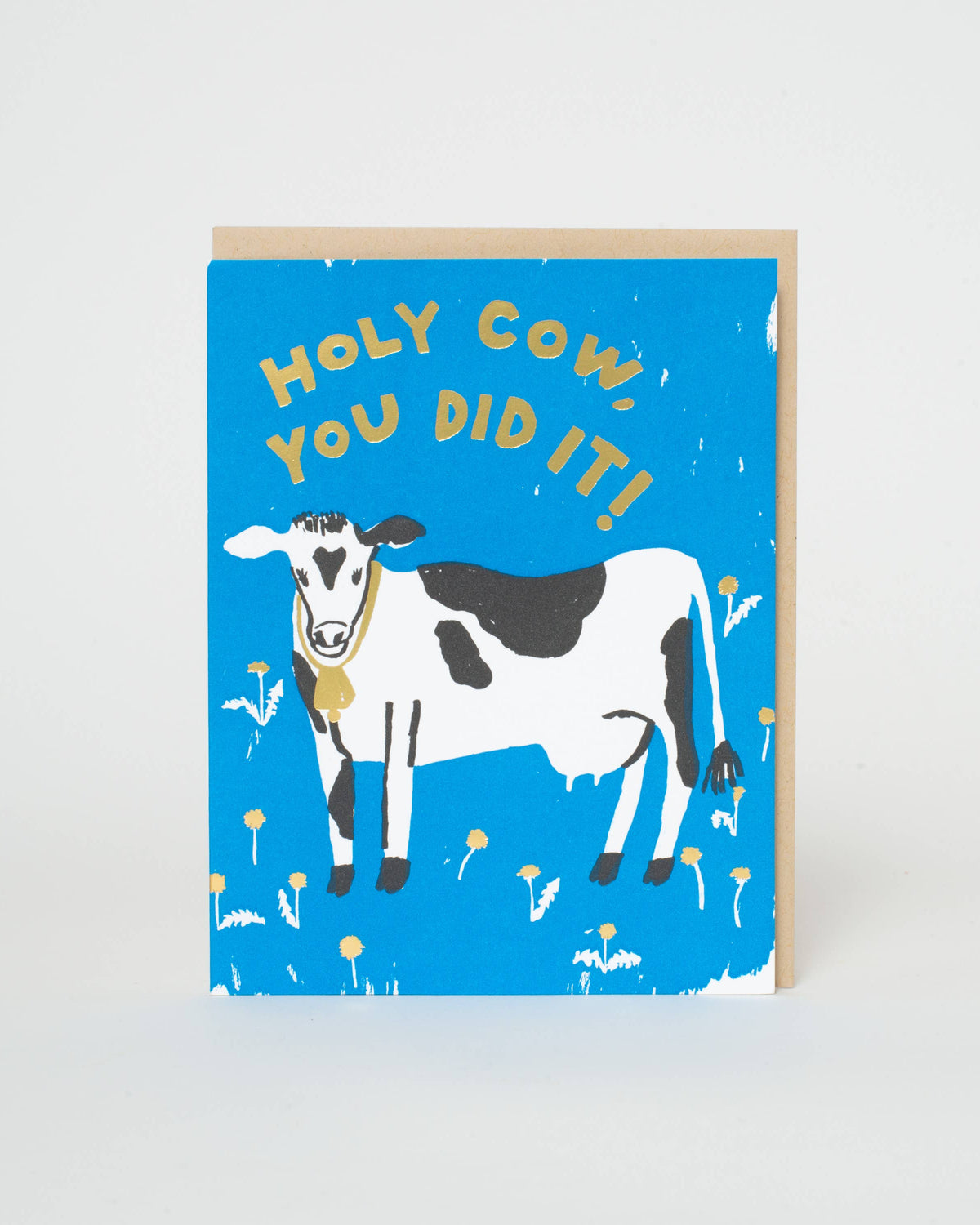 Greeting card with a cow illustration and text on a blue background