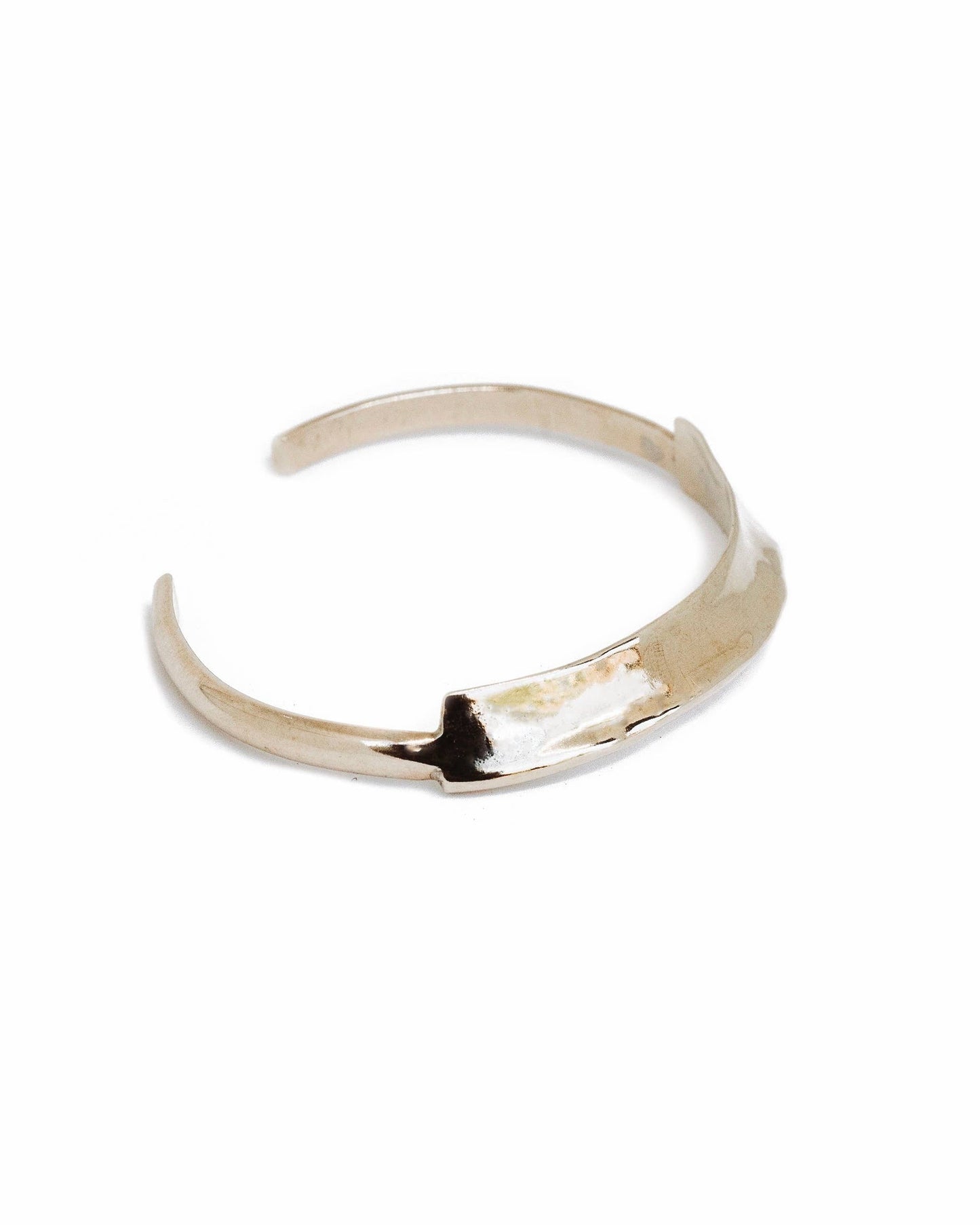 Gold bracelet on a white background