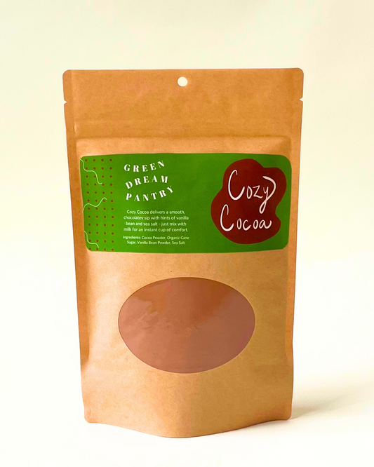 Kraft paper packaging of Cozy Cocoa with a green label on a white background