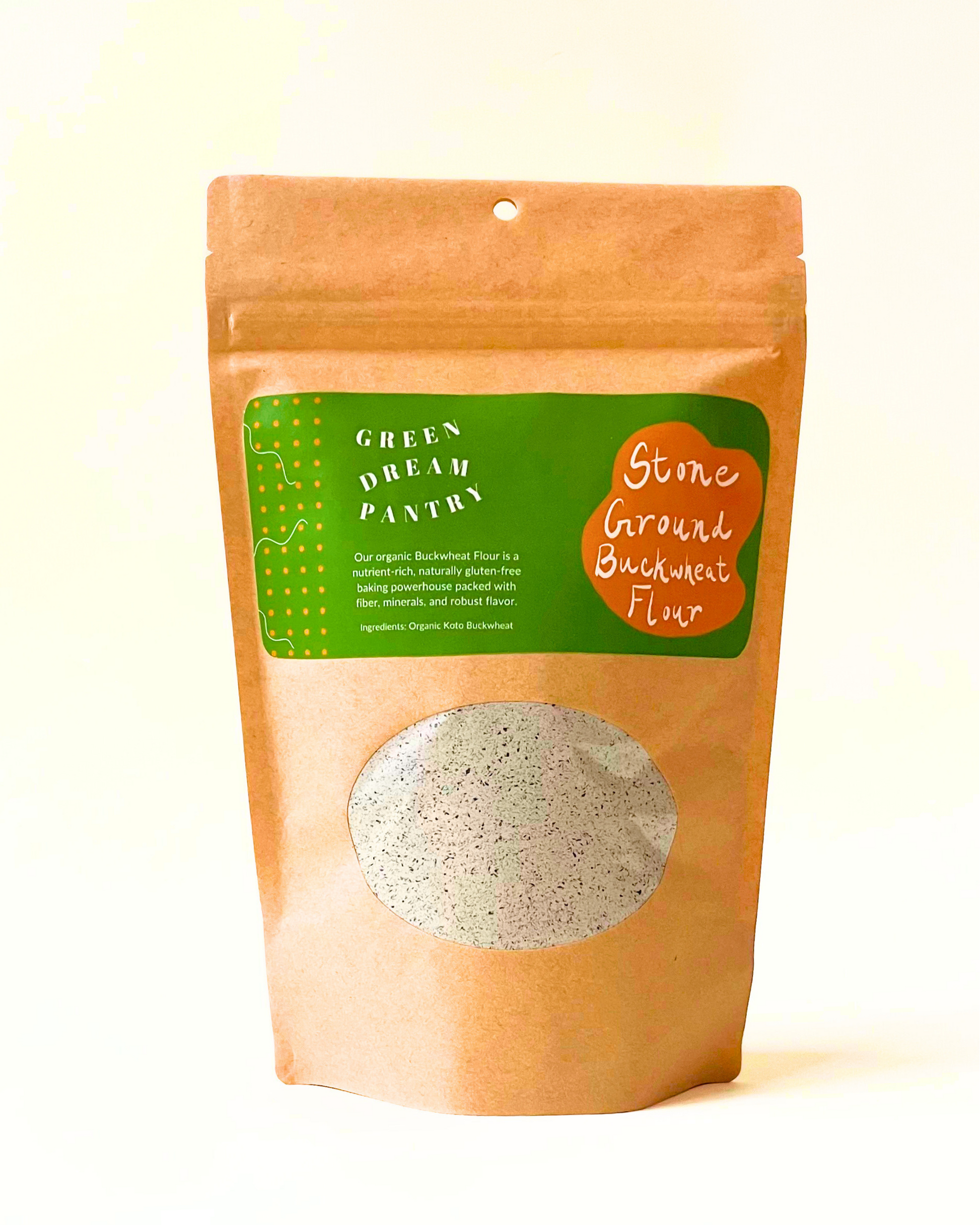 Bag of stone ground buckwheat flour with a green label on a white background