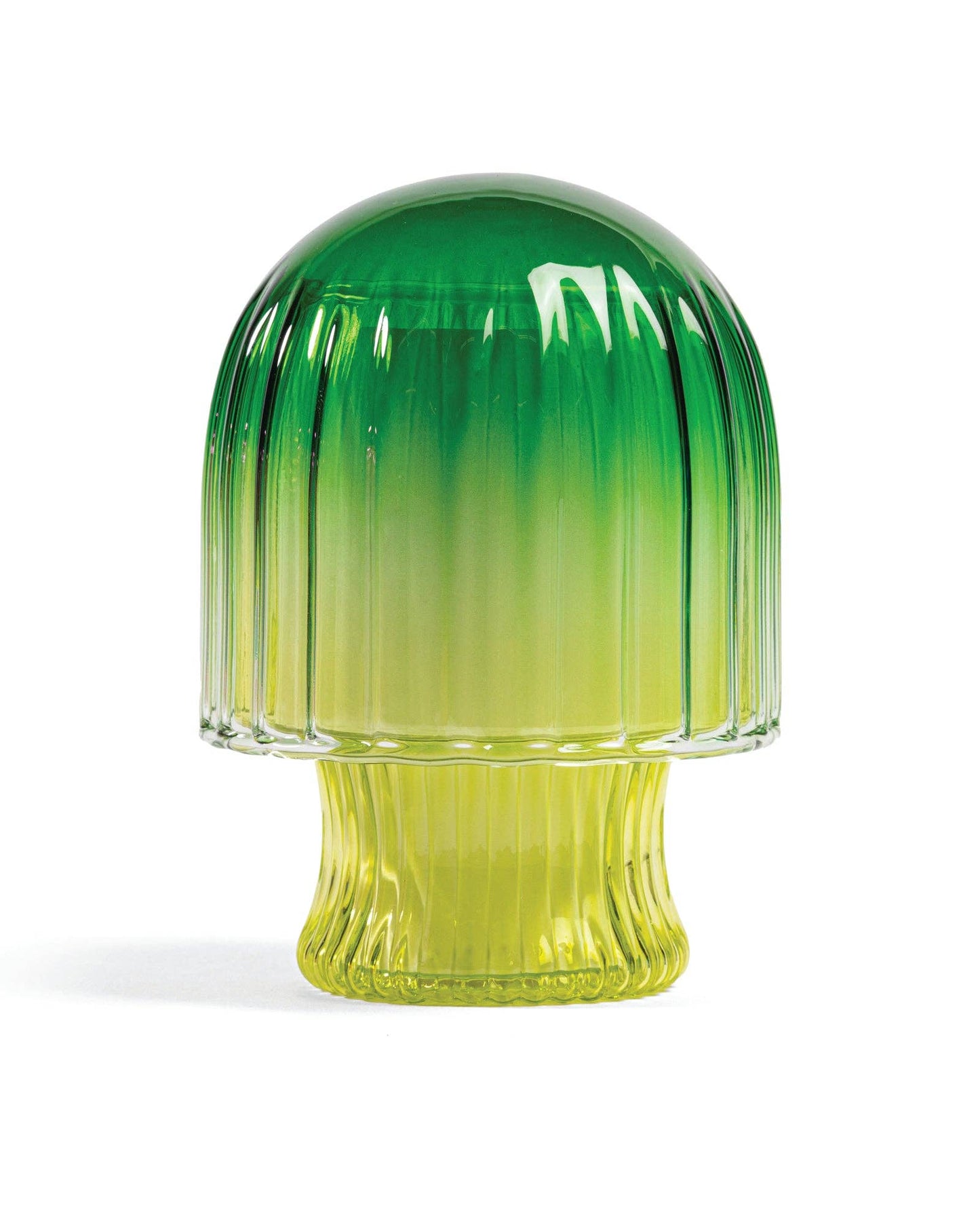 Green and yellow glass vase with ribbed design on a white background