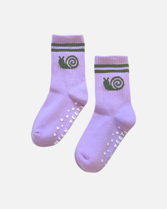 Pair of purple socks with green snail design on a white background