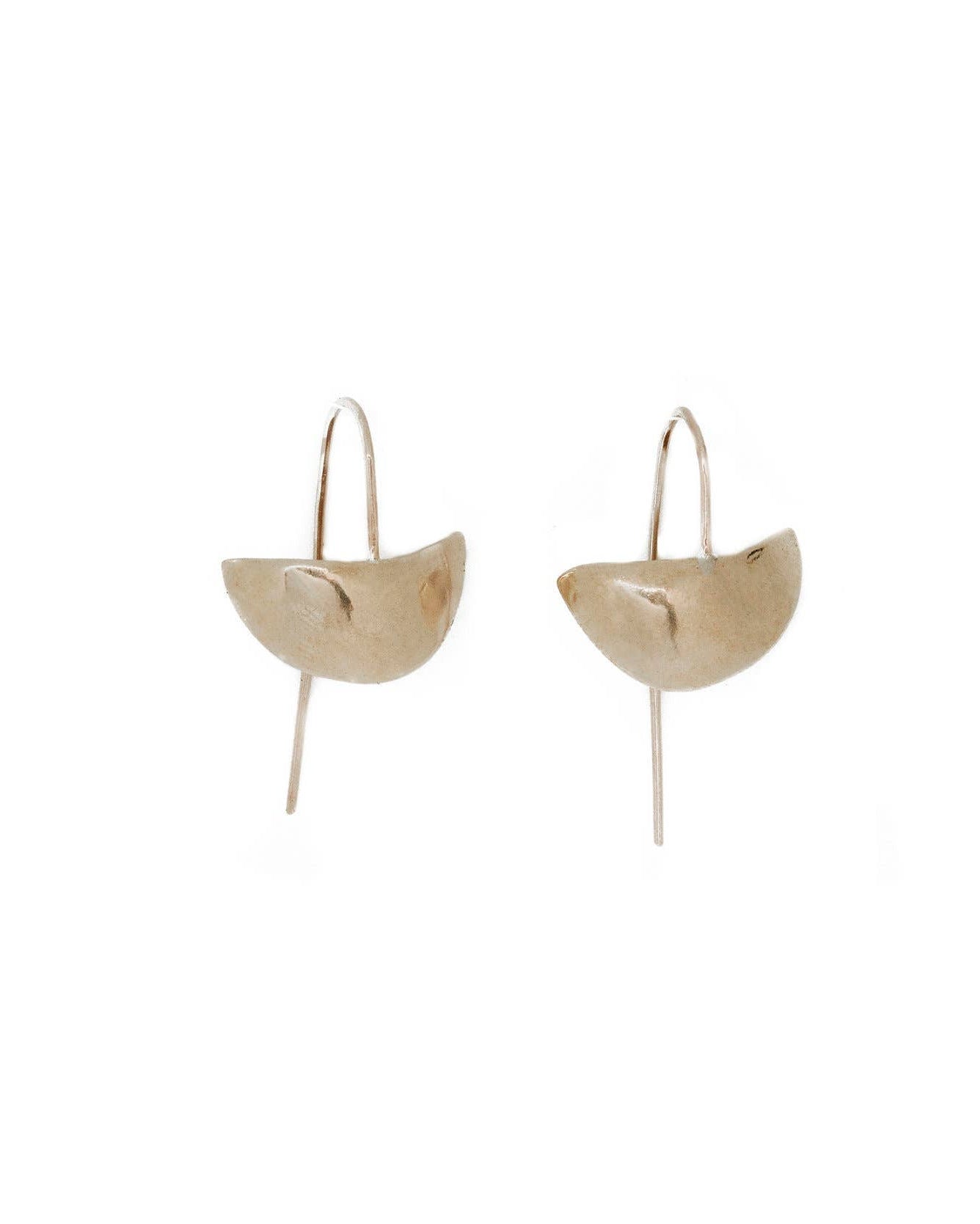 Pair of gold earrings on a white background