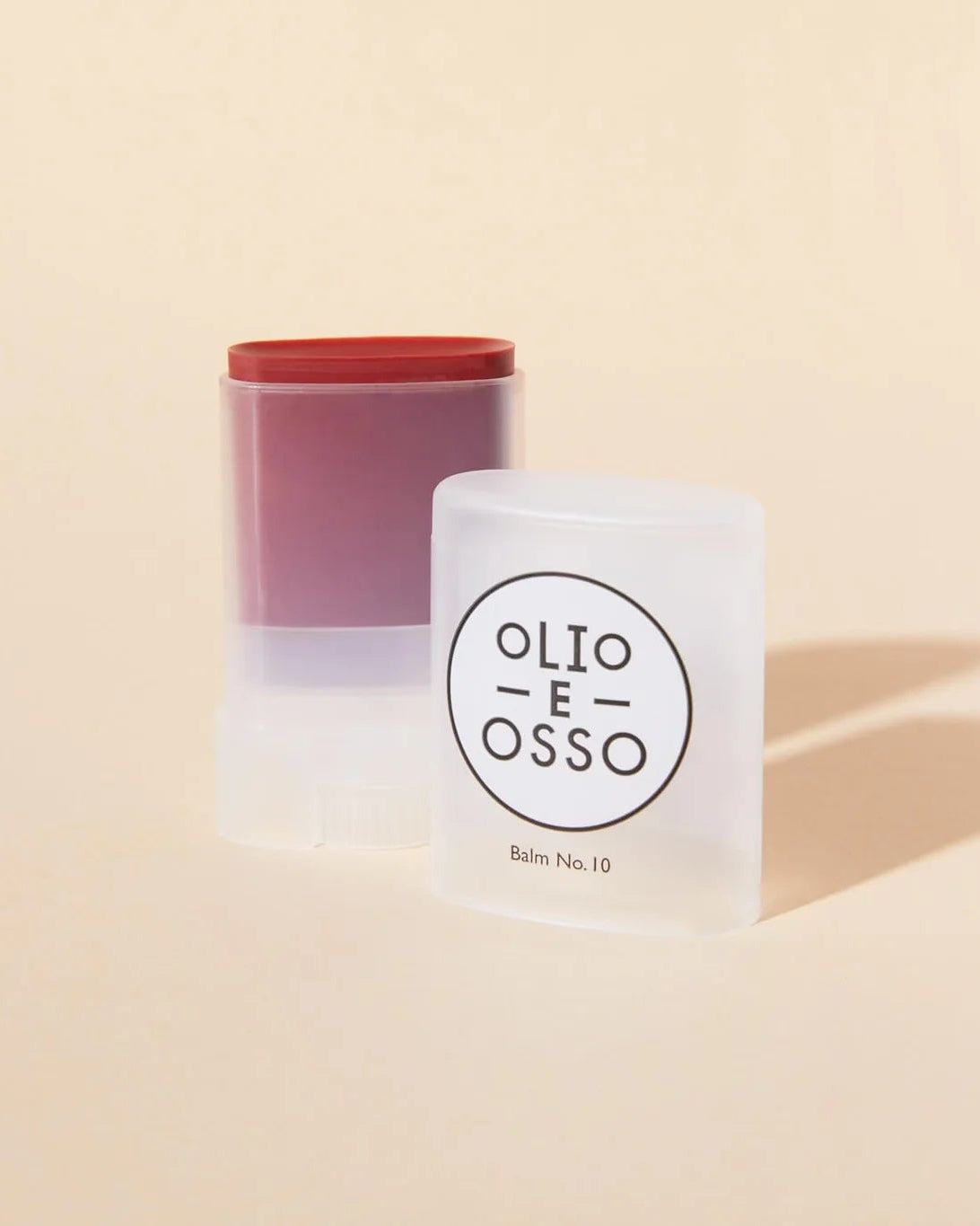 Two containers with a visible brand logo on a beige background