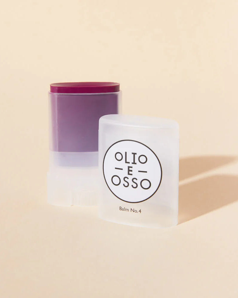 Two skincare products with 'Olio E Osso' branding on a beige background