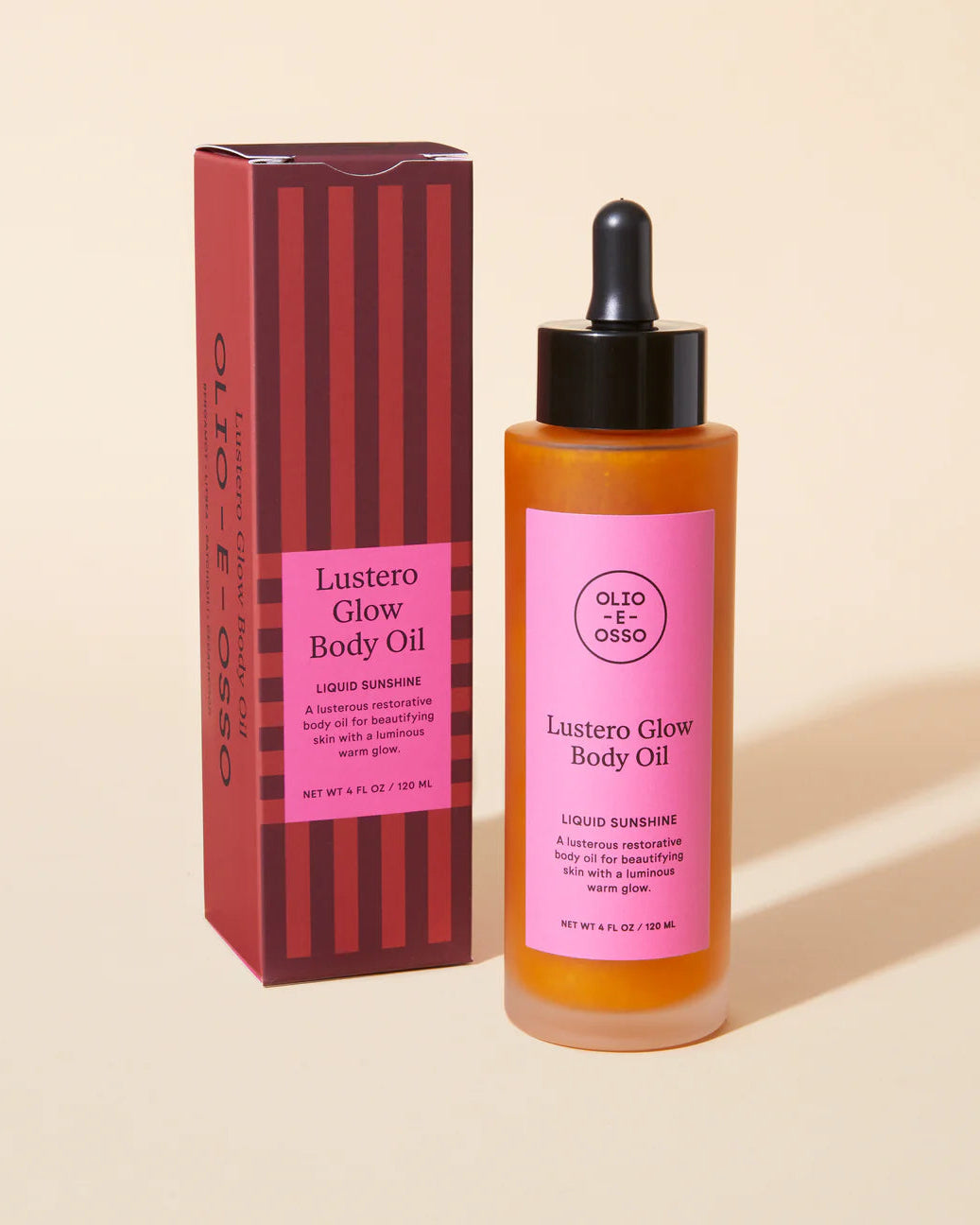 Lustero Glow Body Oil bottle and packaging on a beige background