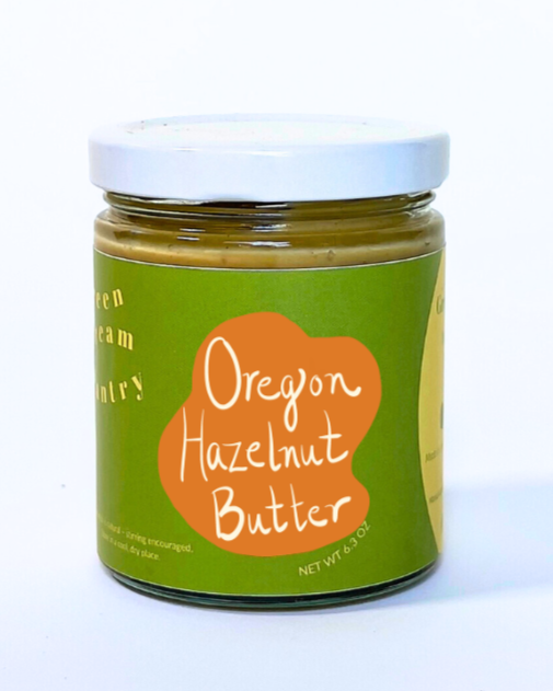 Jar of Oregon Hazelnut Butter with a green label on a white background