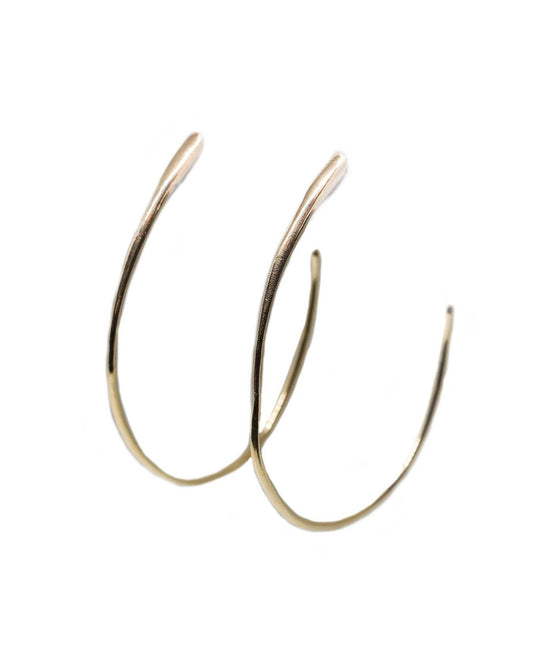 Gold hoop earrings on a white background