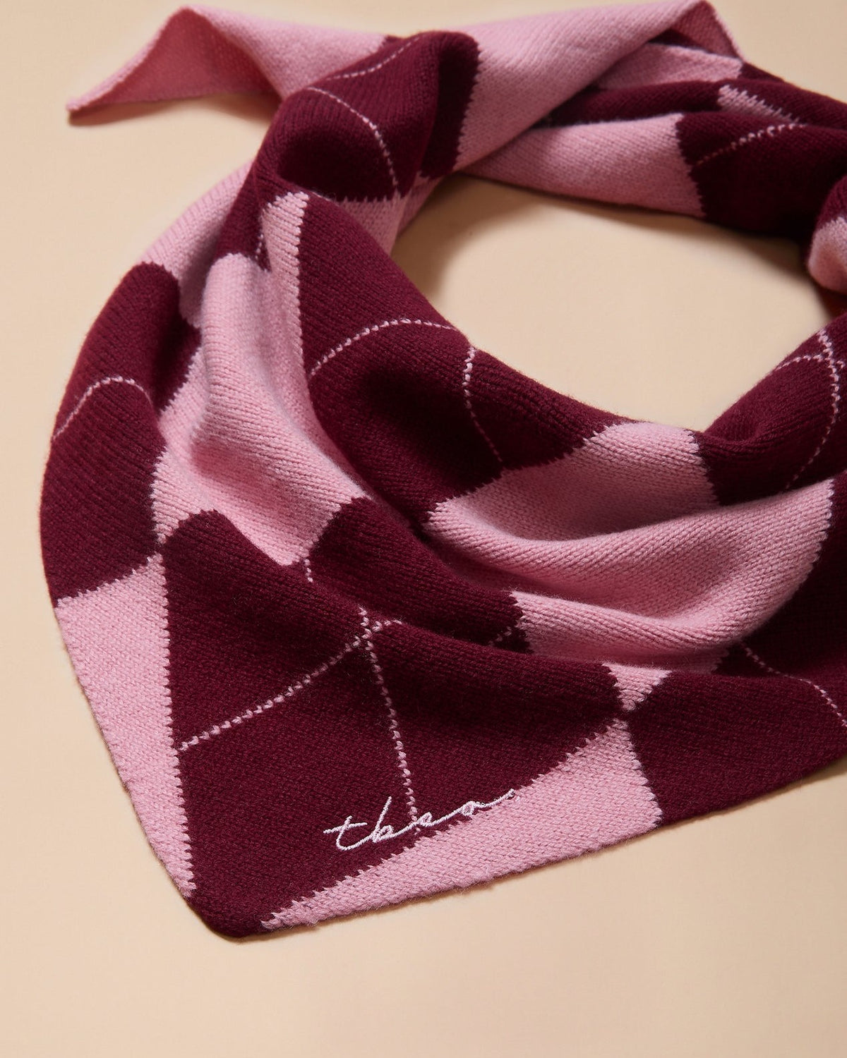 Merino Wool Triangle Scarf in Pink Argyle - product photo