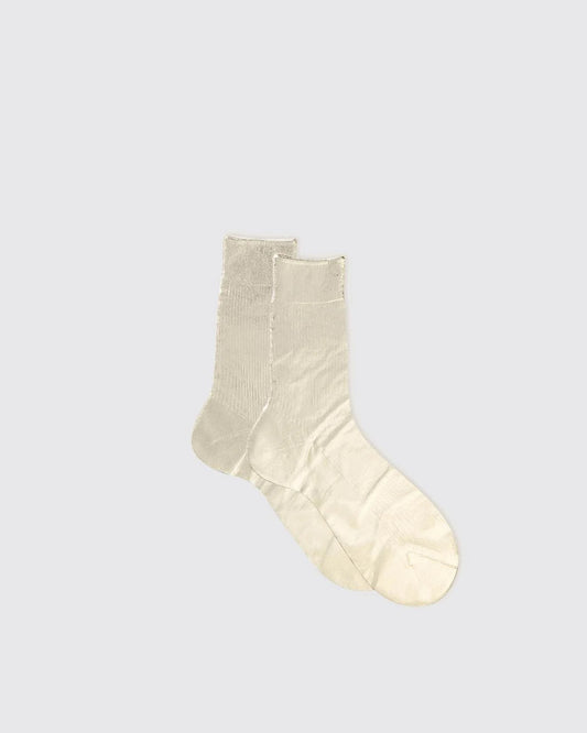 Pair of beige socks on a light gray background