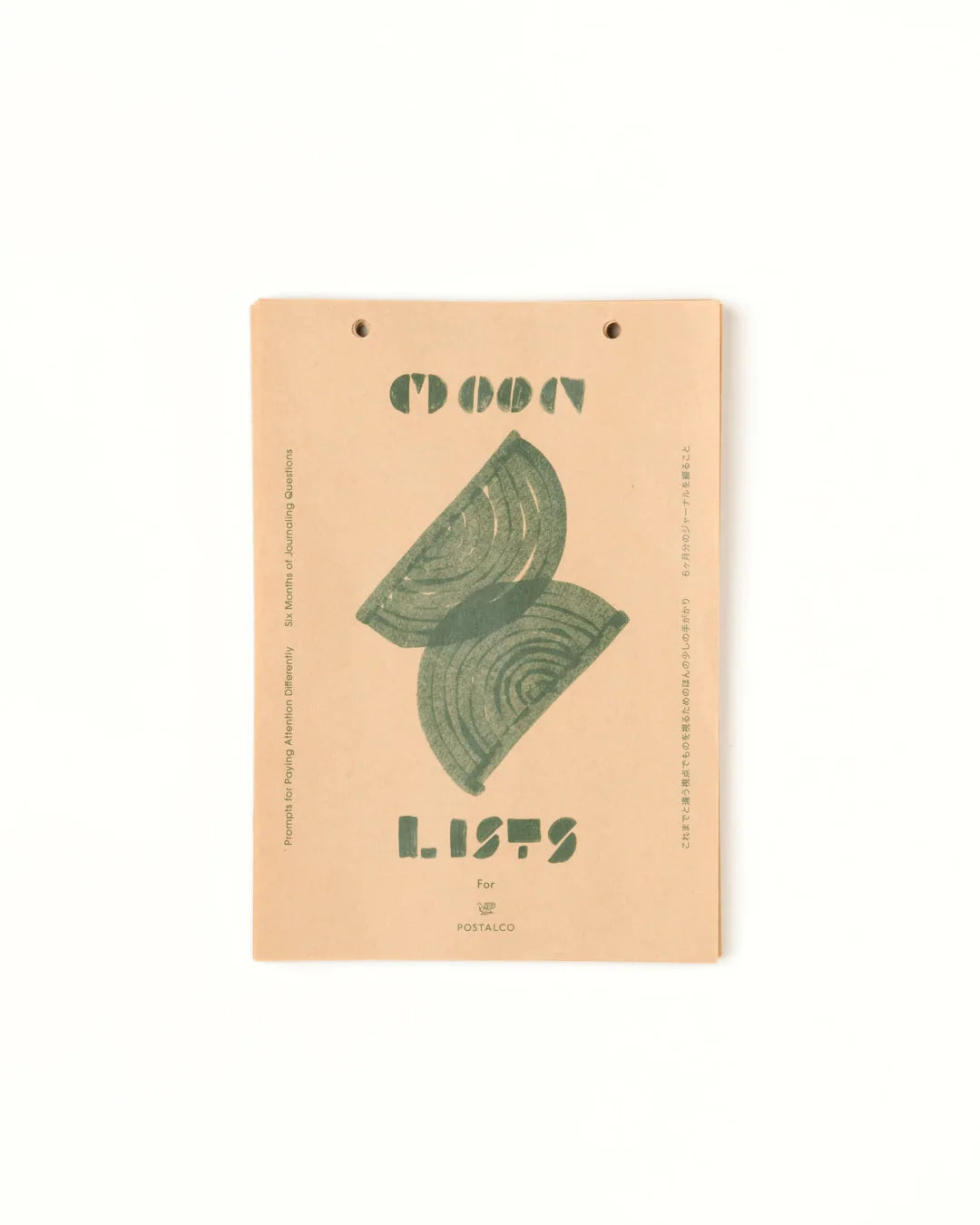 Notebook with green leaf design and 'Lists' text on a beige background