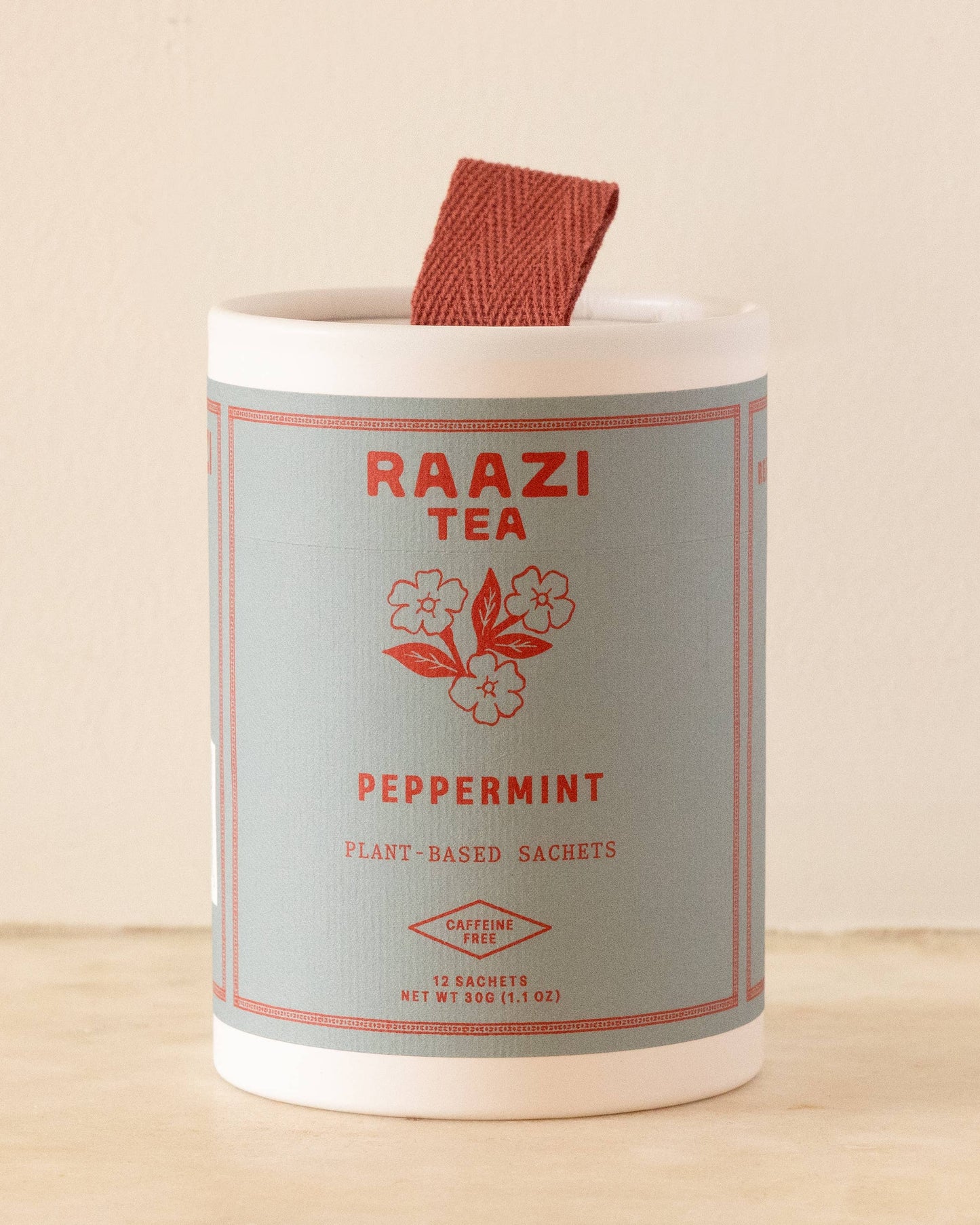 Raazi Tea peppermint tea packaging on a beige background