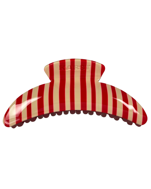 Red and beige striped hair clip on a white background