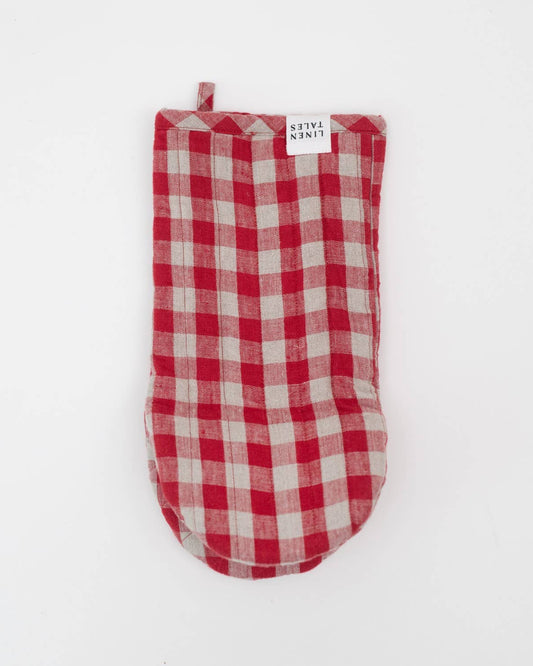 Red and white checkered oven mitt on a light gray background