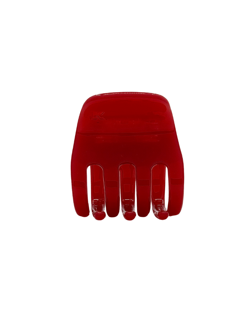 Red hair comb on a white background
