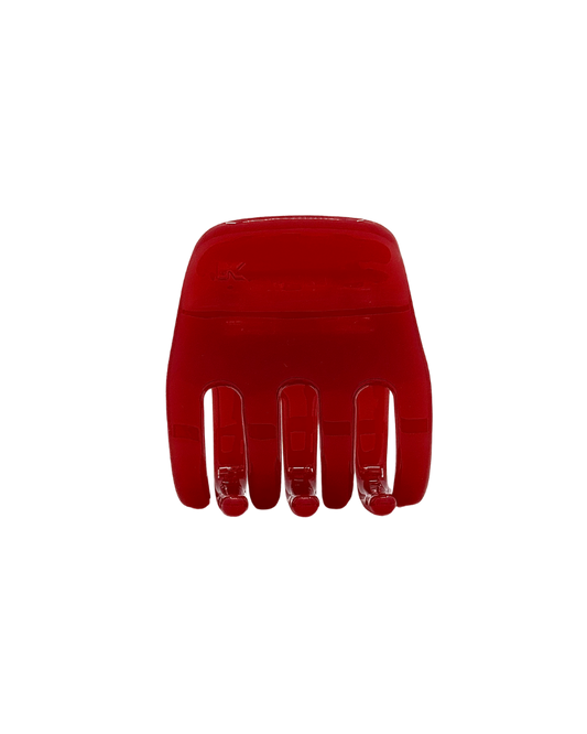 Red hair comb on a white background
