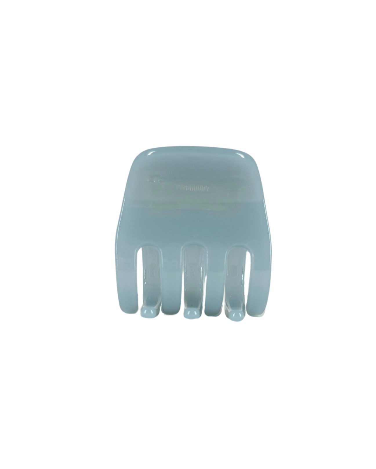 Light blue plastic hair claw on a white background