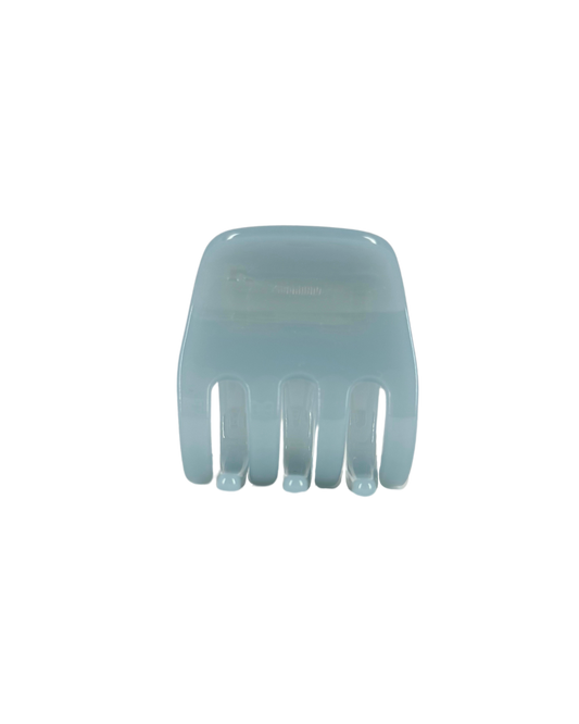 Light blue plastic hair claw on a white background