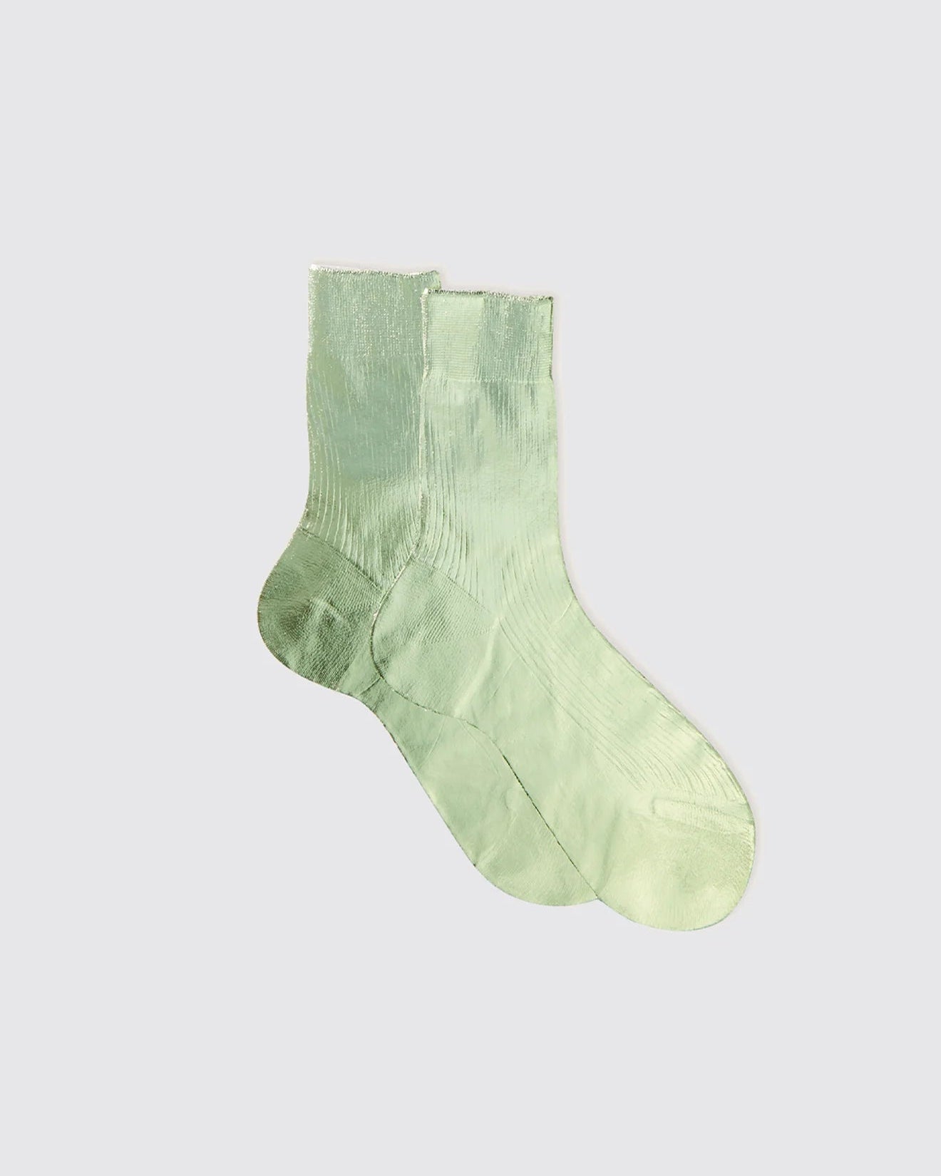 Green sock on a light gray background